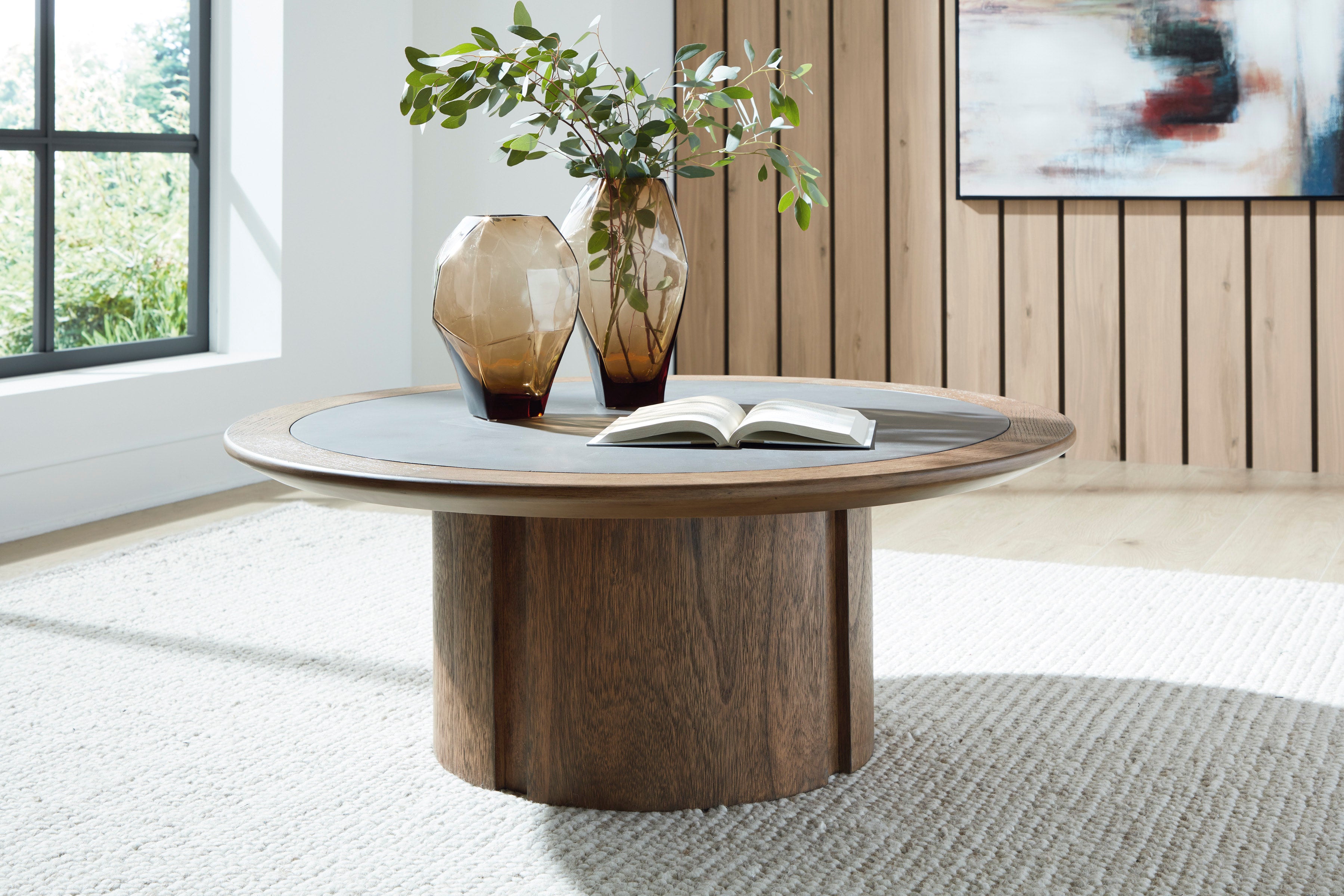 Ashley Warm Brown Round Cocktail Table with Faux Cement Top